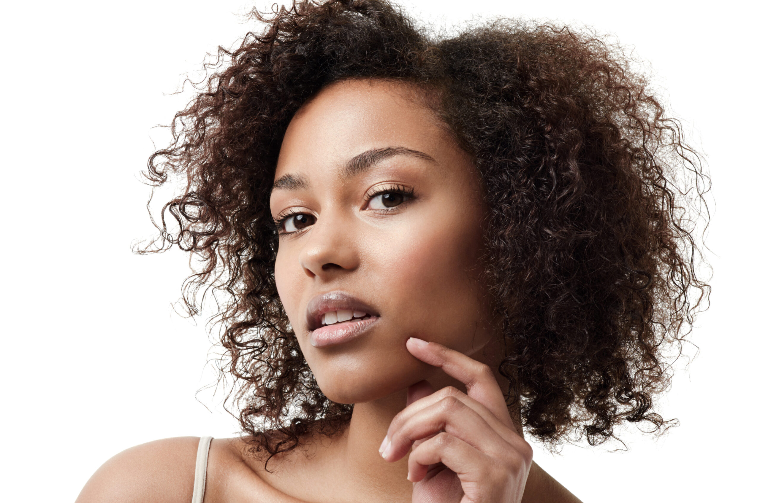 Skincare, face and portrait of African woman on white background with cosmetics, glowing skin and glamour. Natural makeup, beauty mockup and beautiful, attractive and confident female model in studio.